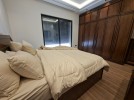 First-floor apartment for sale in Qaryet Al-Nakheel with a building area of 243m