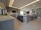 First-floor apartment for sale in Qaryet Al-Nakheel with a building area of 243m