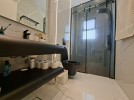 First-floor apartment for sale in Qaryet Al-Nakheel with a building area of 243m