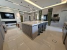 First-floor apartment for sale in Qaryet Al-Nakheel with a building area of 243m