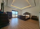 First-floor apartment for sale in Qaryet Al-Nakheel with a building area of 243m