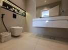 First-floor apartment for sale in Qaryet Al-Nakheel with a building area of 243m